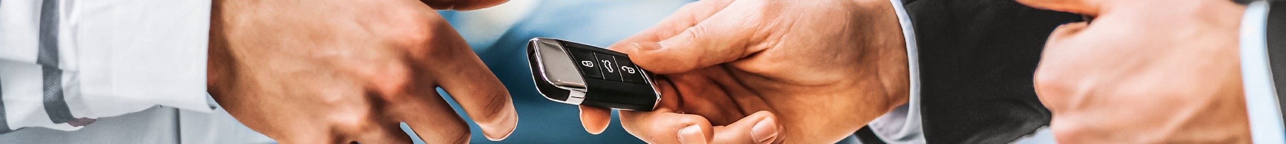hands changing car key