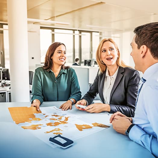 man presents to three colleagues