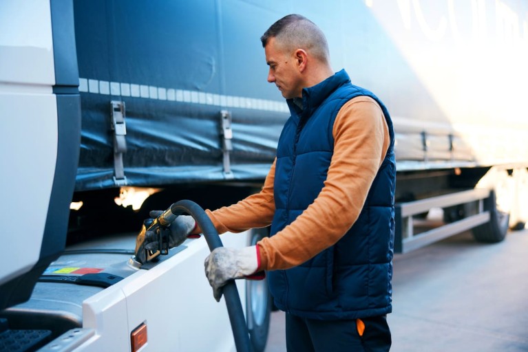 Trucker refueling his truck.