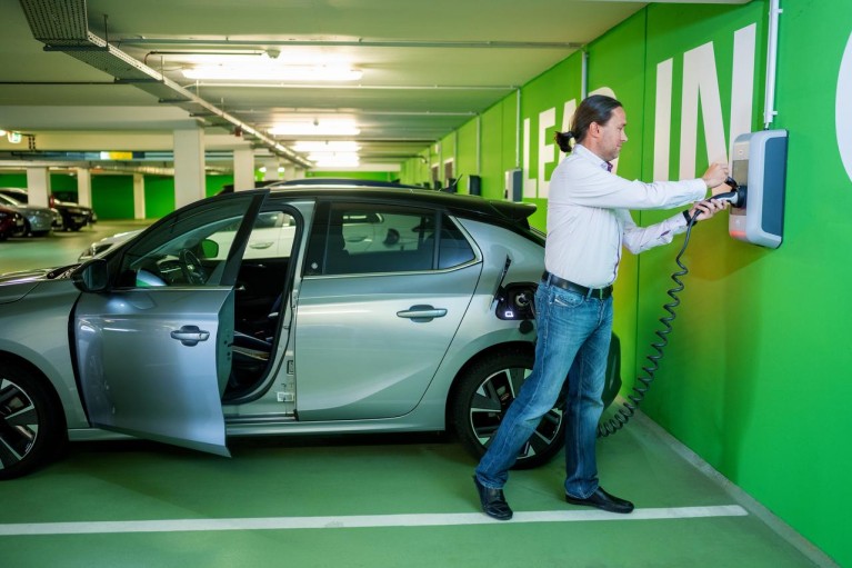 Man charging his EV car