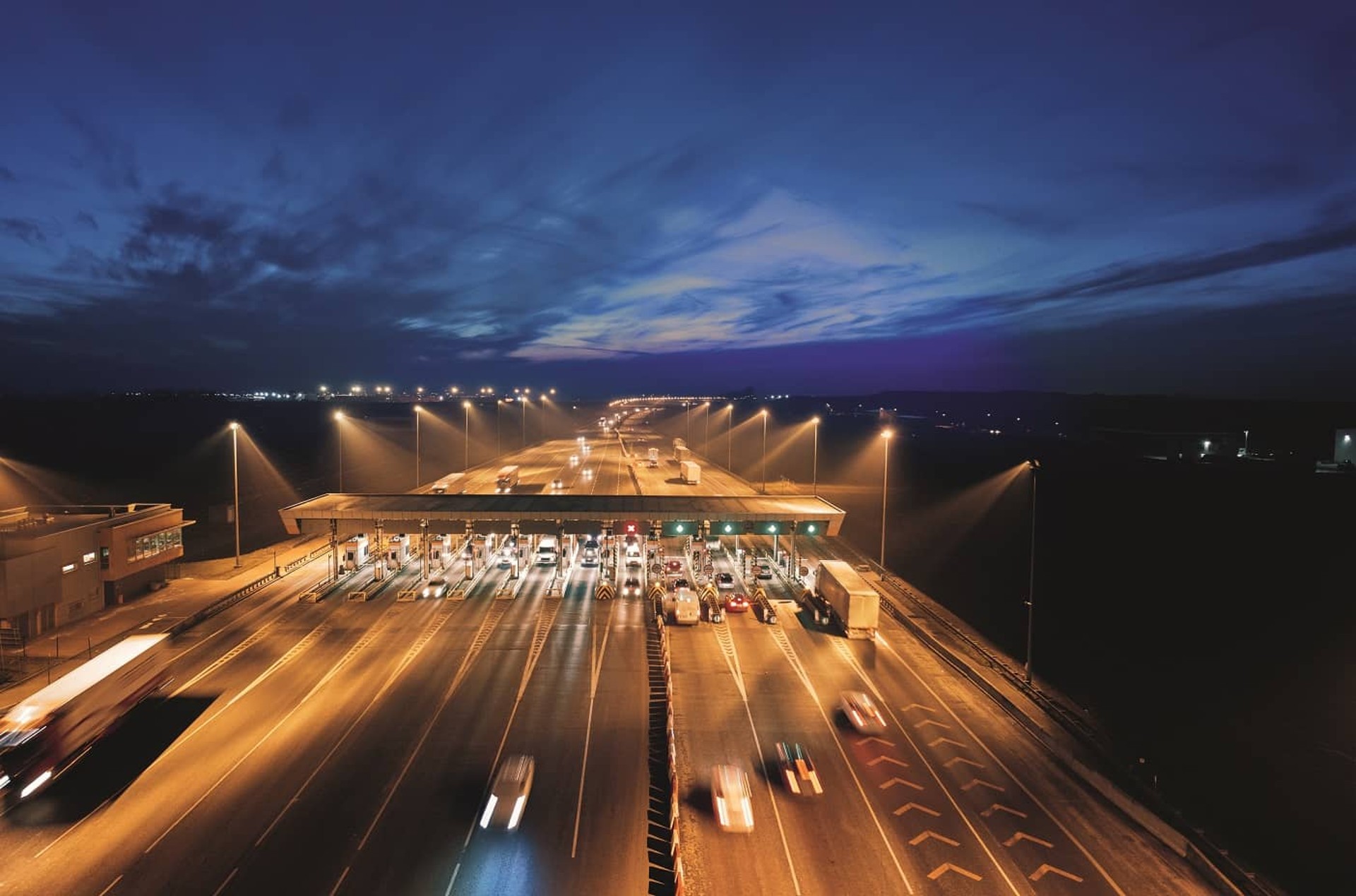 Toll station at a highway by night