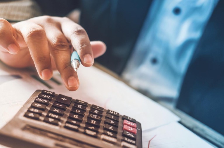 Man using a calculator