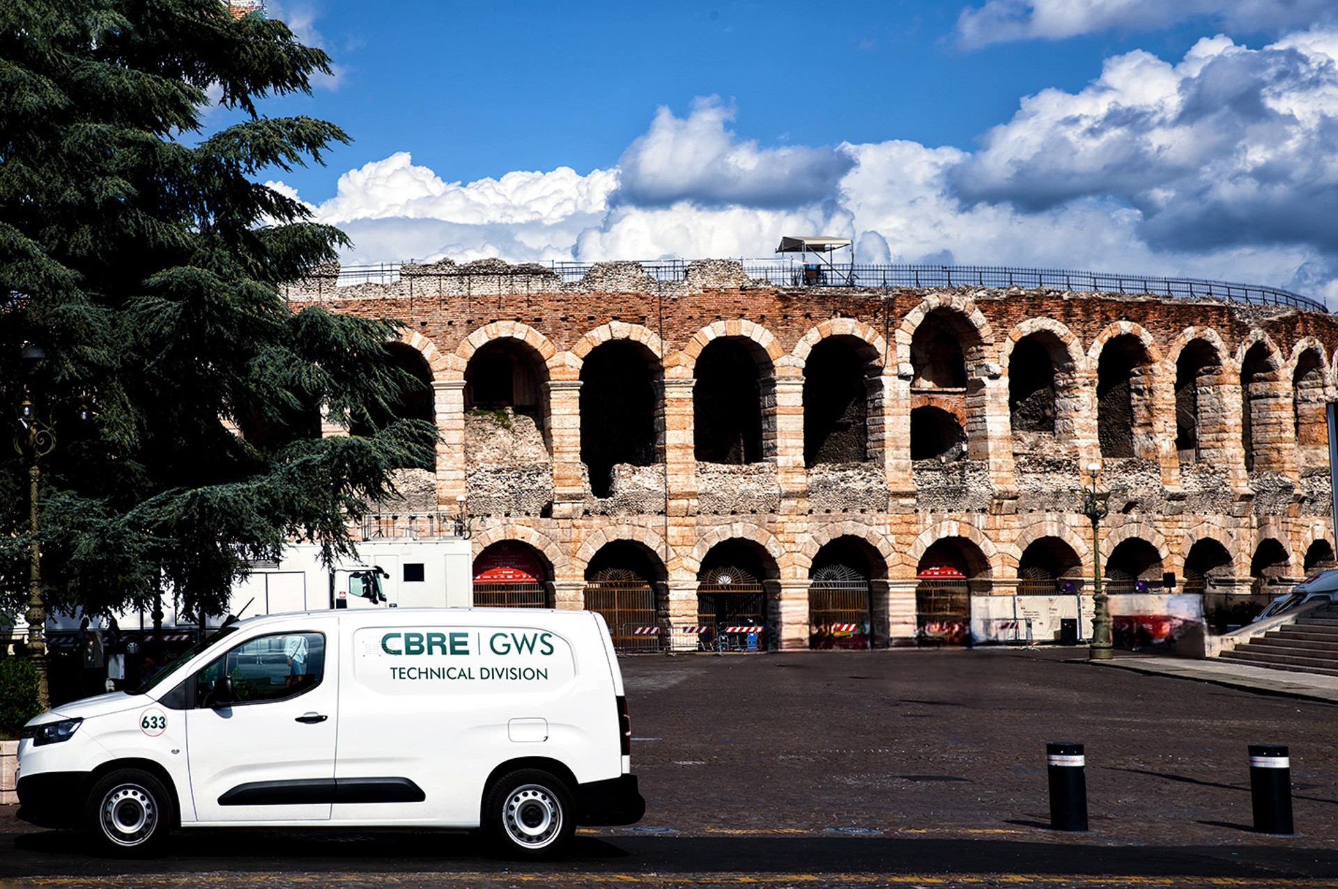 CBRE GWS car in front of the colooseum in Rome