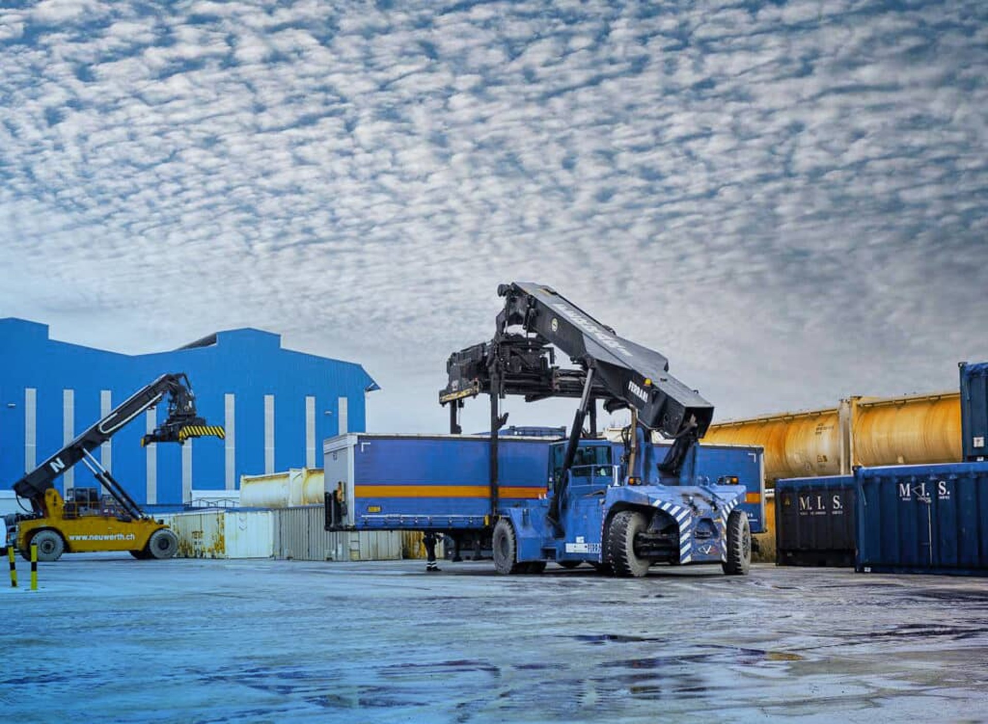 Containers that get loaded on a truck.