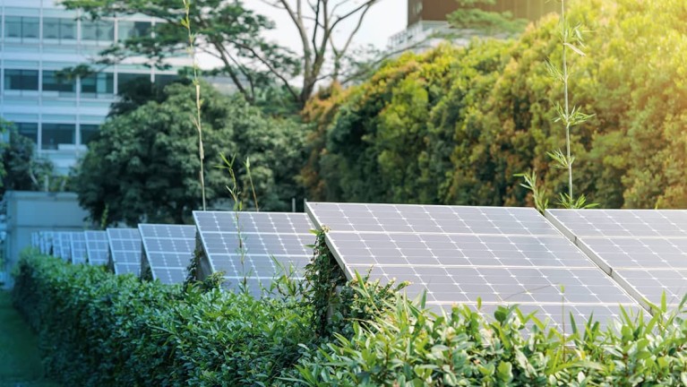 Solar panels in front of a building,