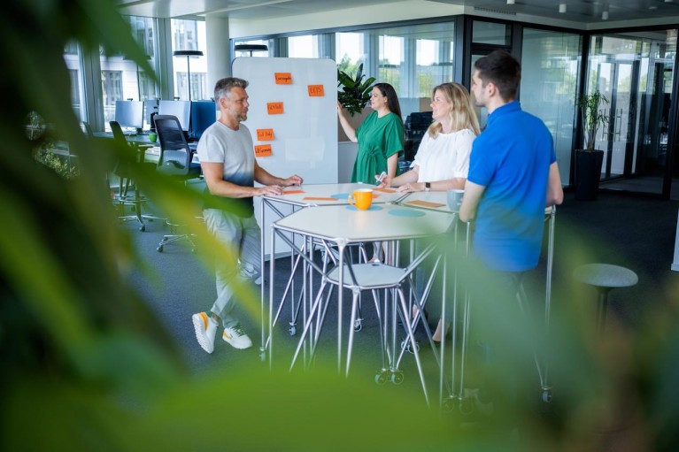 Colleagues in a meeting at DKV Mobility office