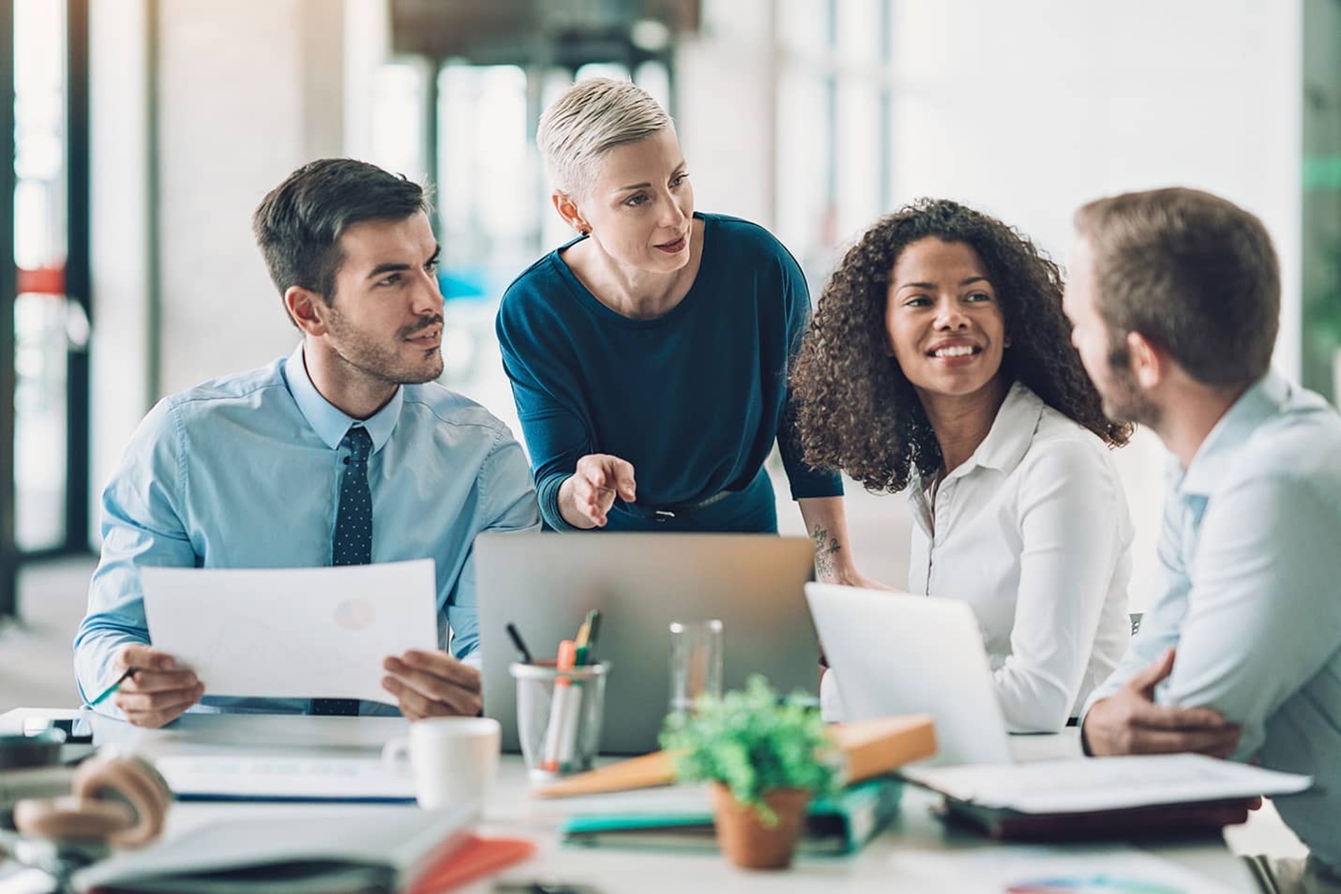 Male and female employees in a meeting