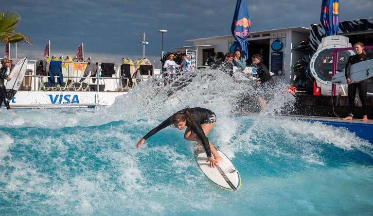 A surfer surfing on a wave