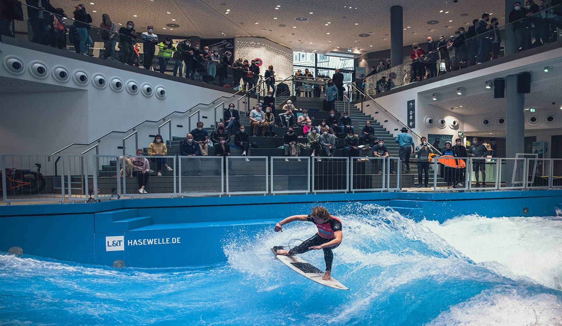 An indoor surfer on a standing wave