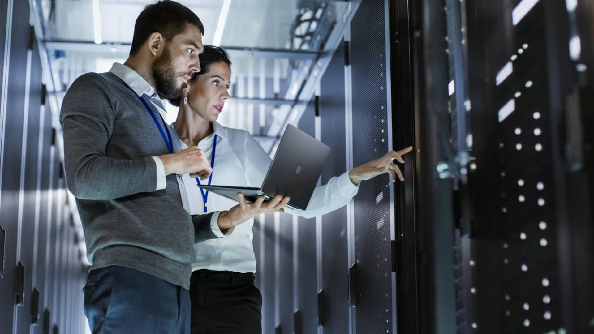 Two people in server room