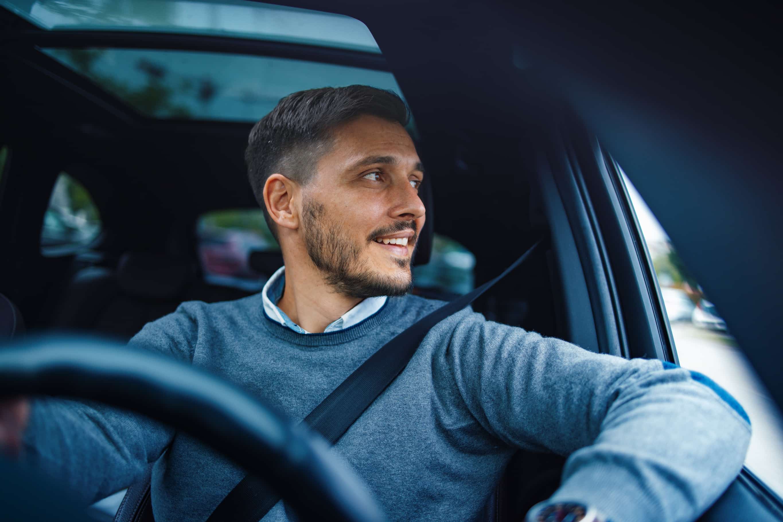 man driving car