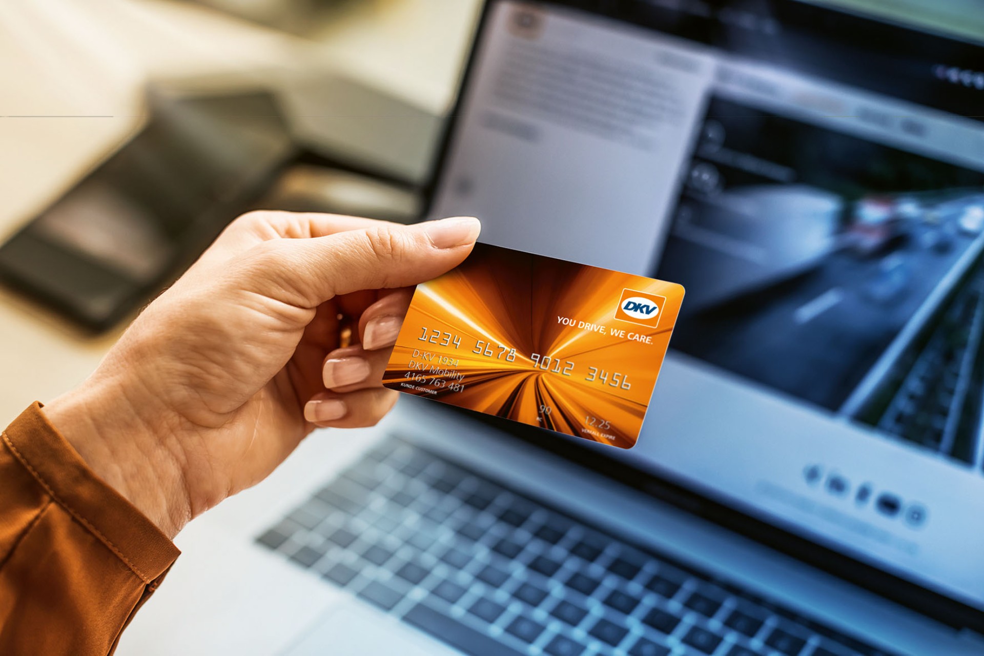 Person with the DKV Card in his hands Person with the DKV Card in his hands