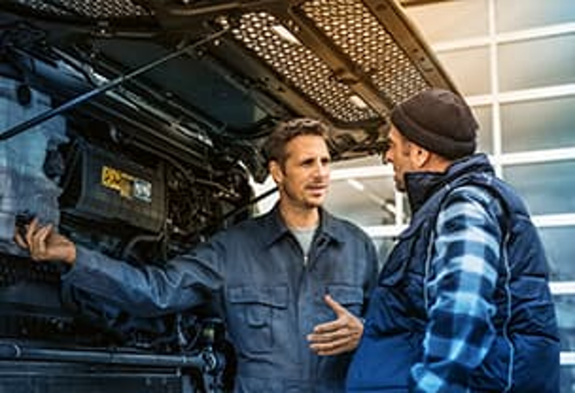 Two people in a workshop Two people in a workshop