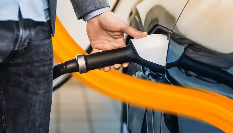 Person charging E-Mobility car