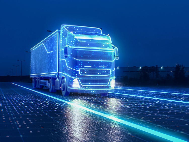 DKV Mobility digital Truck on road at night