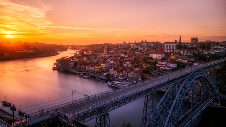 Porto at sunset with the Dom Luís I Bridge.
