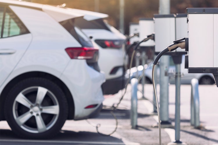 Electric cars charging at a charging station.